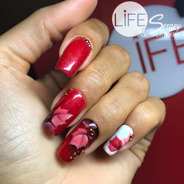 red and white fall nail design with -maple leaves