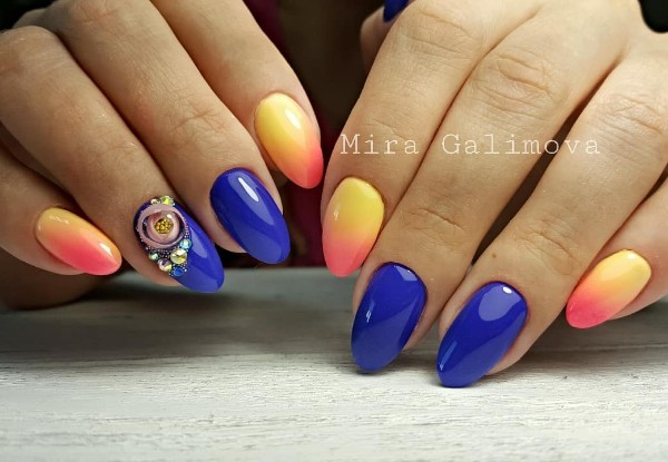 blue and orange nails with candy ball