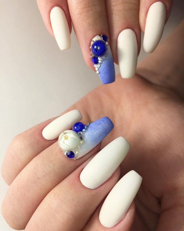 white and blue matte nails with flower ball