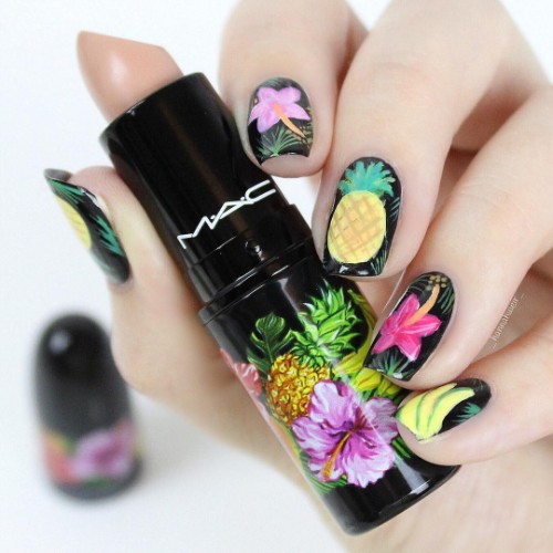 black nails with pineapple and bright flowers