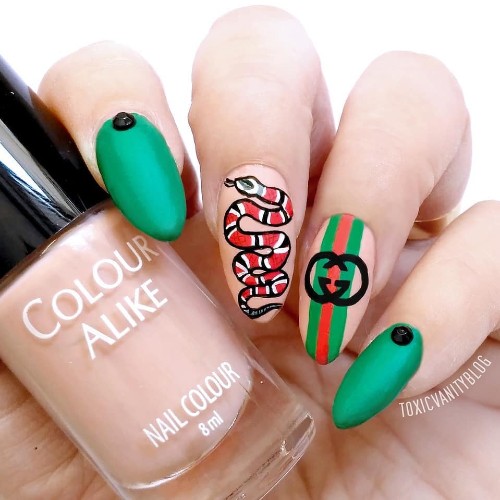 bright green nails with stripes and snake Gucci