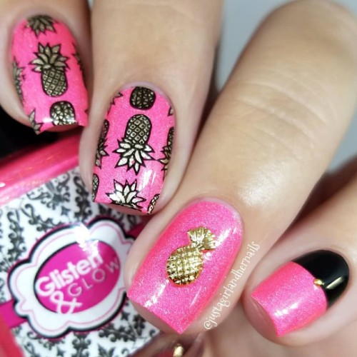 bright pink nails with golden pineapples