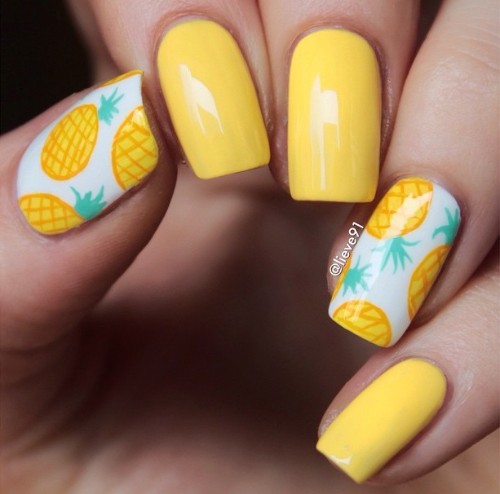 bright yellow pineapple desugn with white accent nails