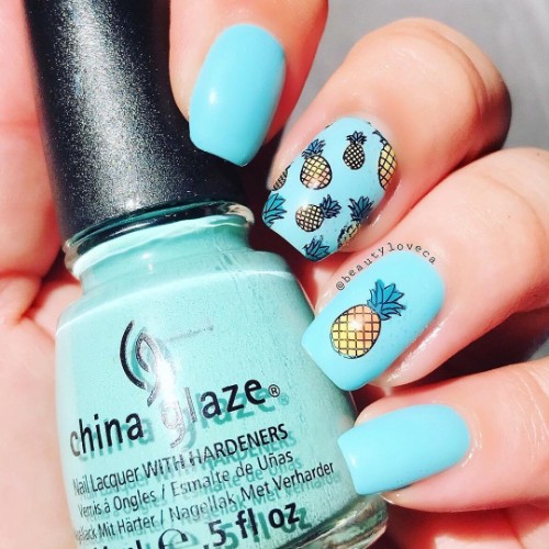 light blue nails with pineapple fruits