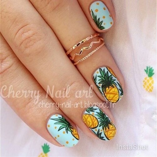 light blue nails with yellow pineapples