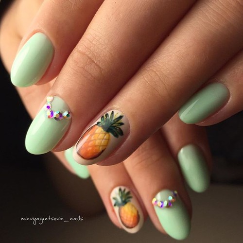 light green nails with pineapples and rhinestones