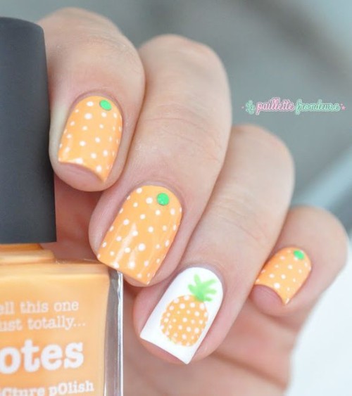 light orange nail design with pineapples