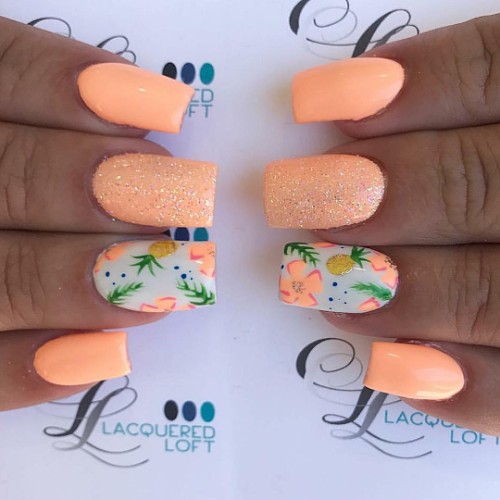 neon peach nails with pineapple fruit