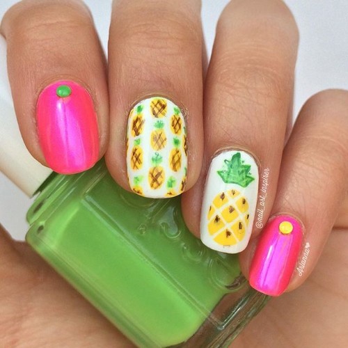 pink and white nails with pineapples