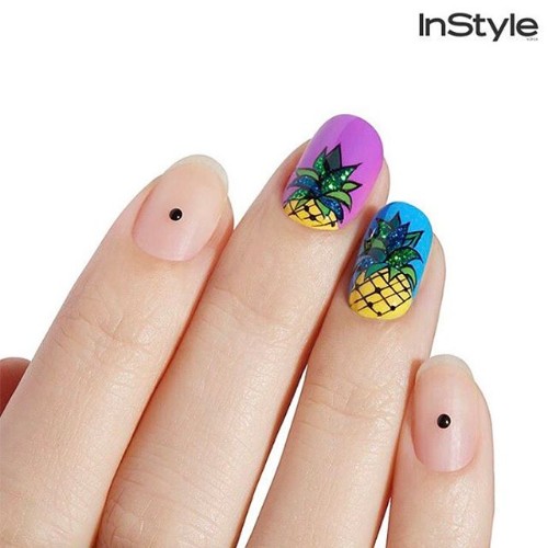 two bright accent nails with pineapples