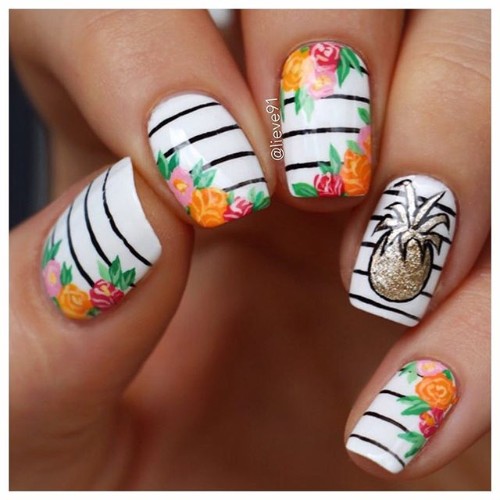 white and black nails with glitter pineapple and orange flowers