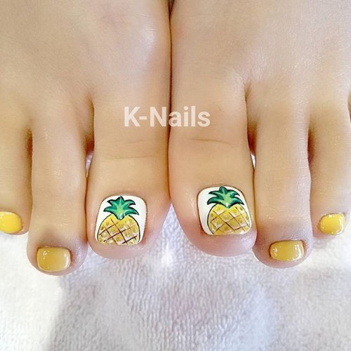 white pedicure with a pineapple