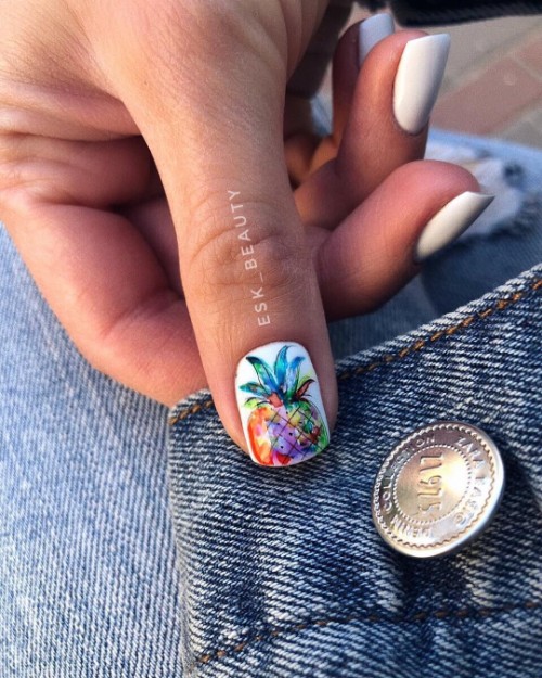 white mani with accent pineapple nail