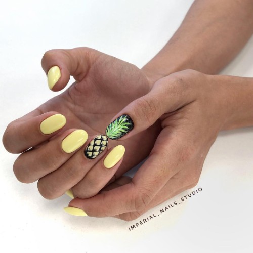yellow and black nail art with pineapples