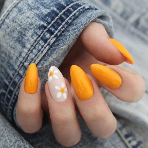 orange and yellow nails with chamomile
