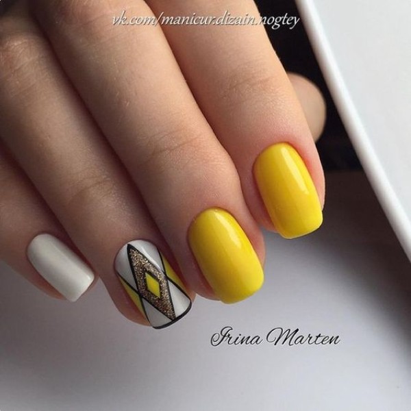 yellow and white nail art with black geometric lines