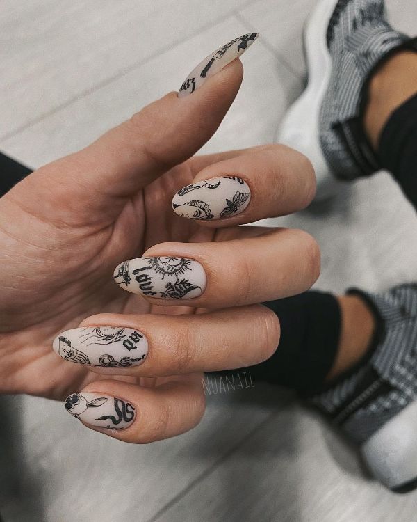 30 Photos of the Coolest Tattoo Nail Designs That Are Trendy in 2024