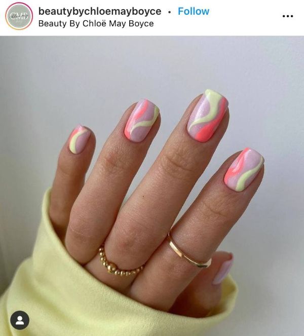 Green and Pink Nail Polishes on Nails
