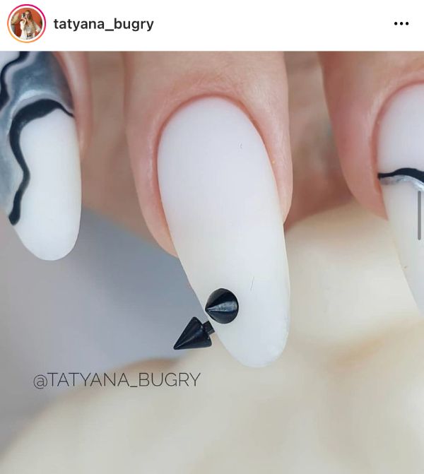 White Nails with Black Piercing