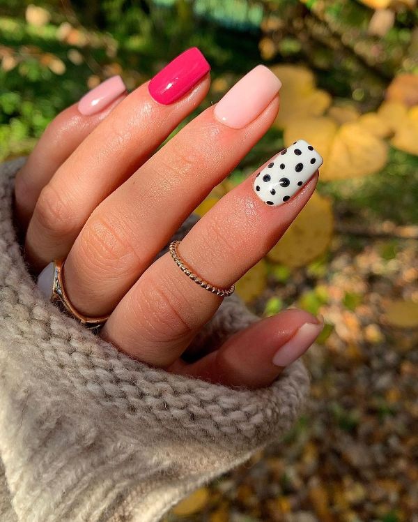 pink nails with black dots