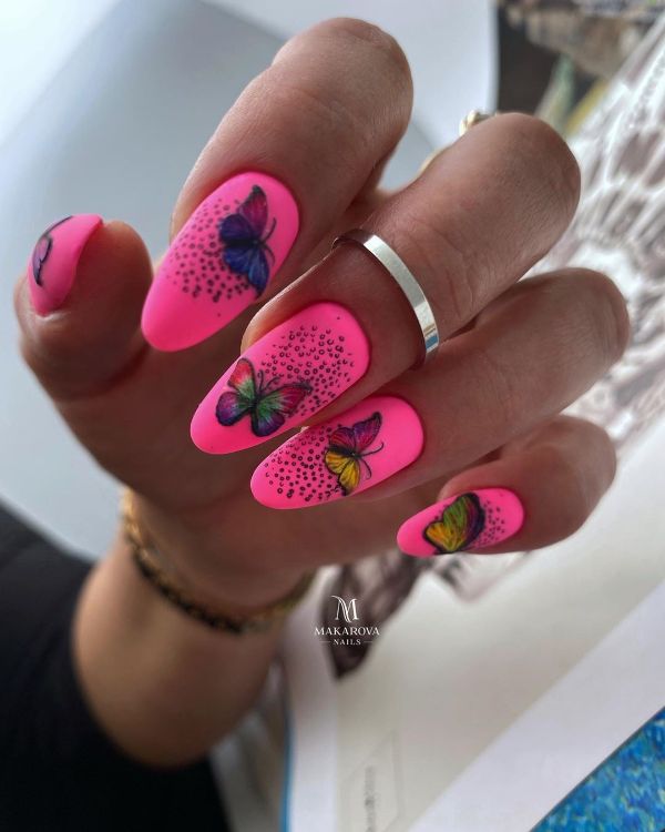 pink nail art with colorful butterflies