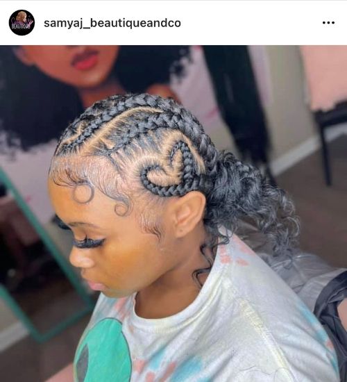 low curly braided bun with a heart