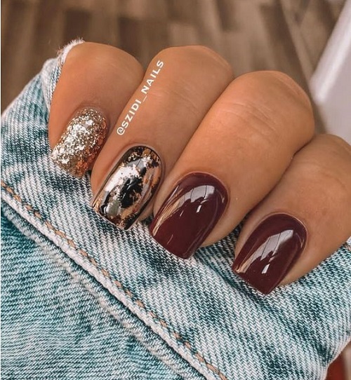 brown nail art with black and gold