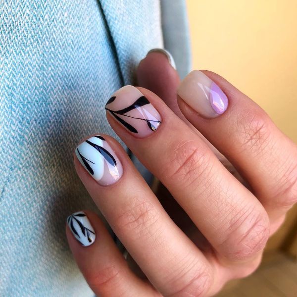 beige nails with black white and purple