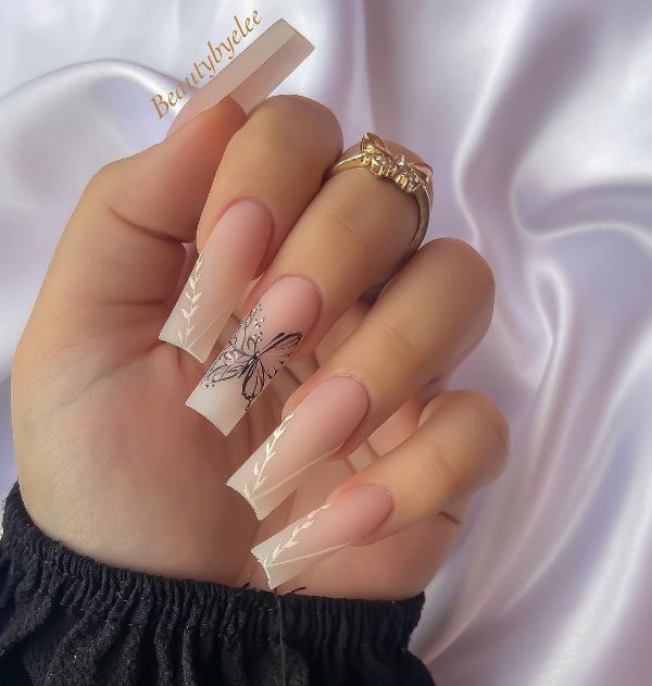 long square beige nails with butterflies