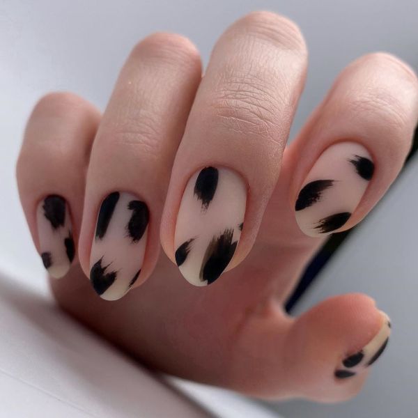 beige nails with black accents