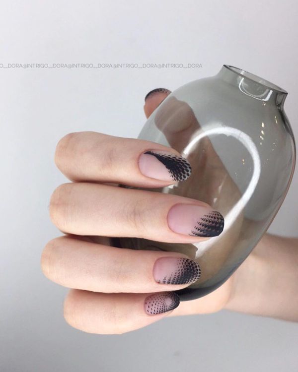 optic illusion black and beige nail design