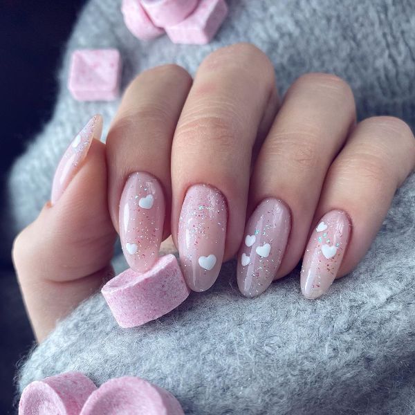 oval nails pink with glitter and hearts