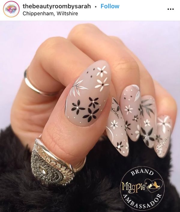 beige floral nail design almond shape