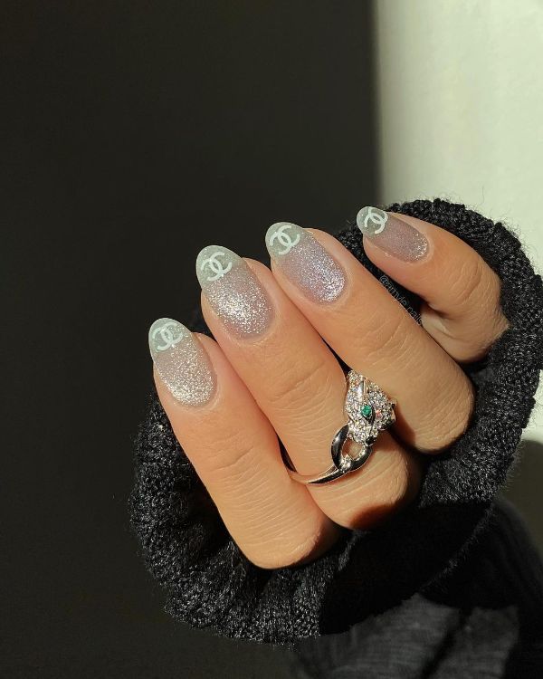 gray nails with brand logos tips