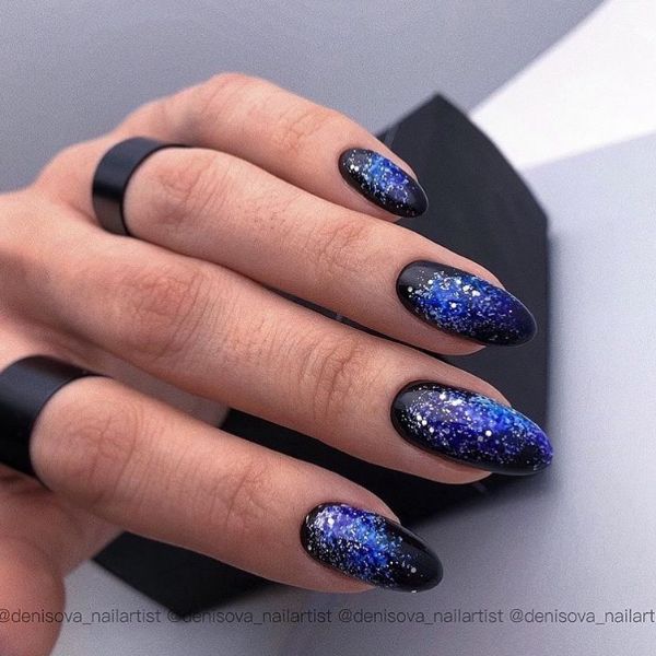 black nails with blue color and glitter