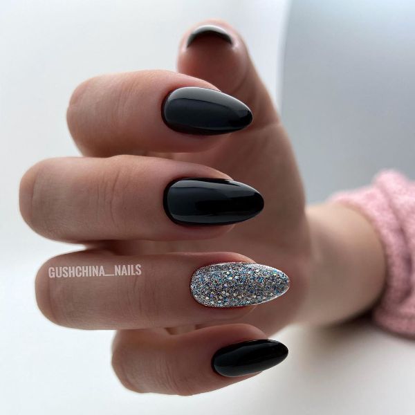 black nails with a shiny accent nail