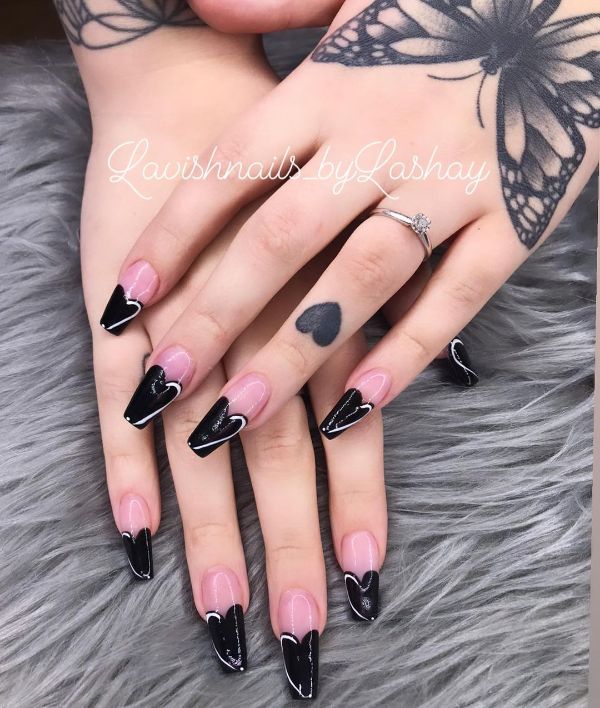 long coffin nails with black hearts on tips