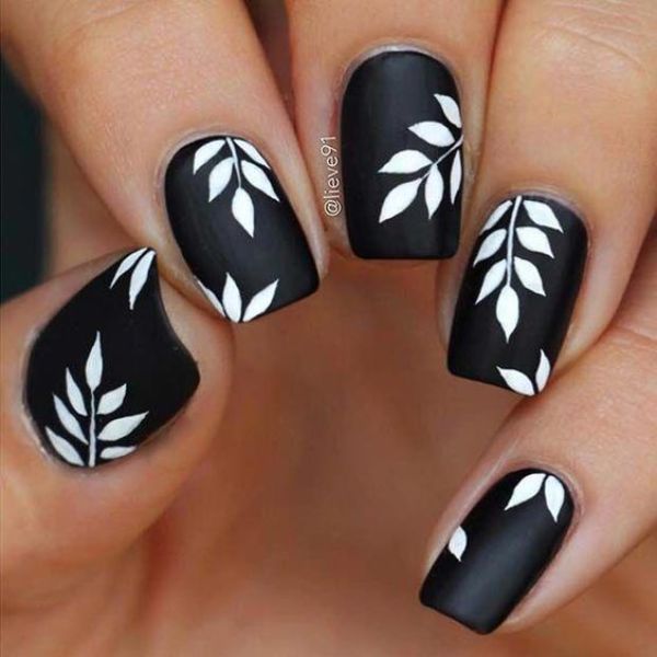 black matte nails with white leaves