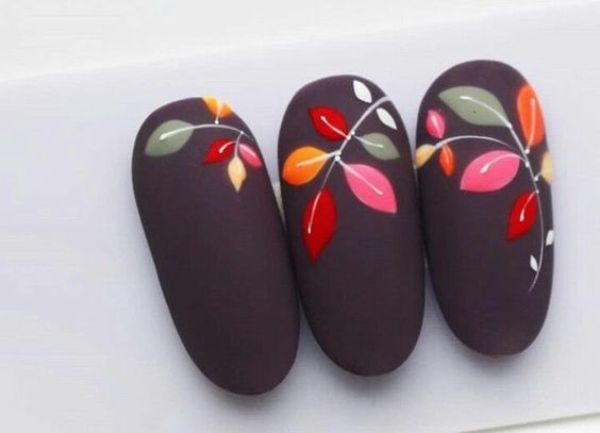 dark brown-gray nails with bright leaves