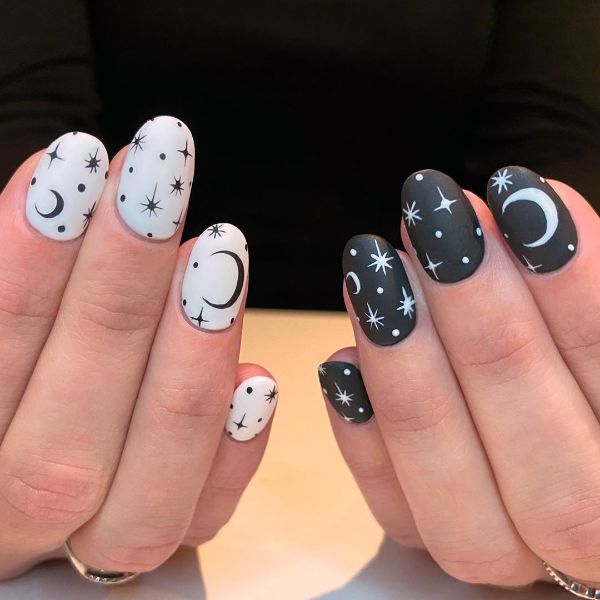 white and black moon and stars nail design