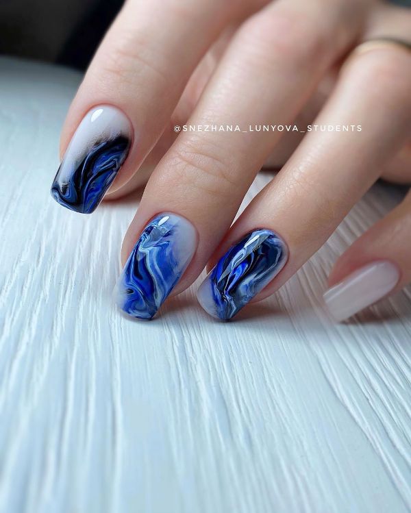 dark blue swirls on nails