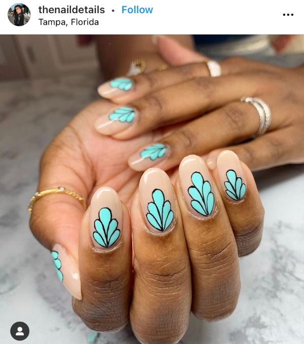 beige nails with light blue leaves