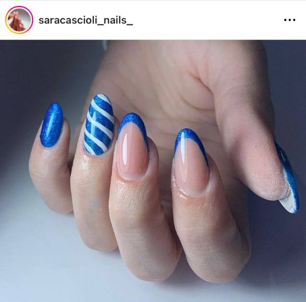 blue French nail tips with one accent white stripes nail