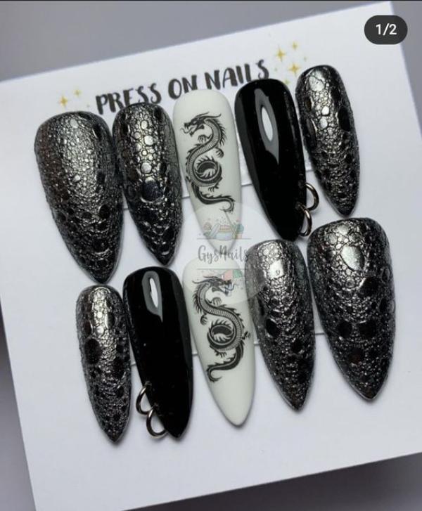 almond shaped black and white pierced dragon nails