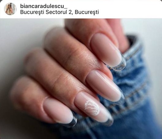 minimalistic beige French glass nails with a white flower