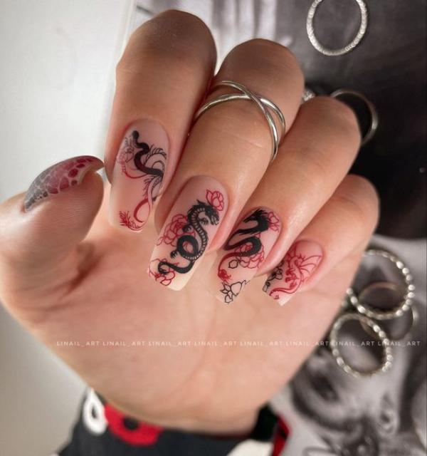 beige dragon nail art design with red flowers