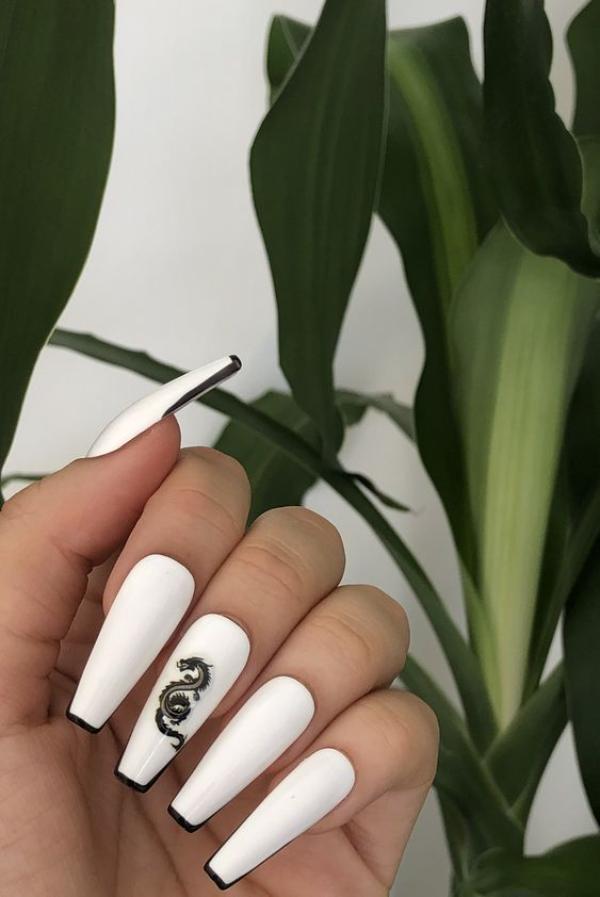 white nails with a black dragon