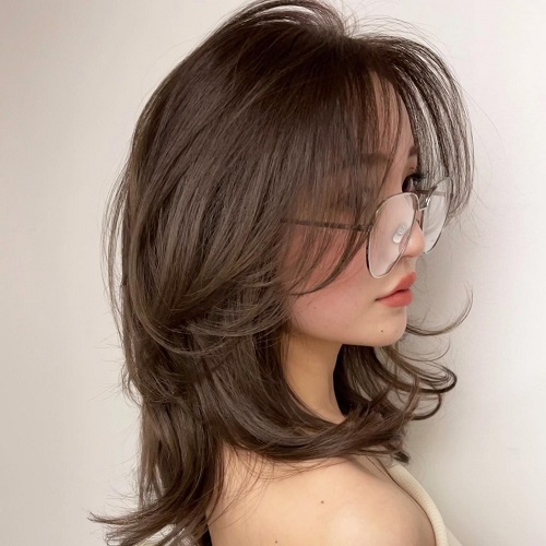 medium hair hairstyle with Korean curtain bangs