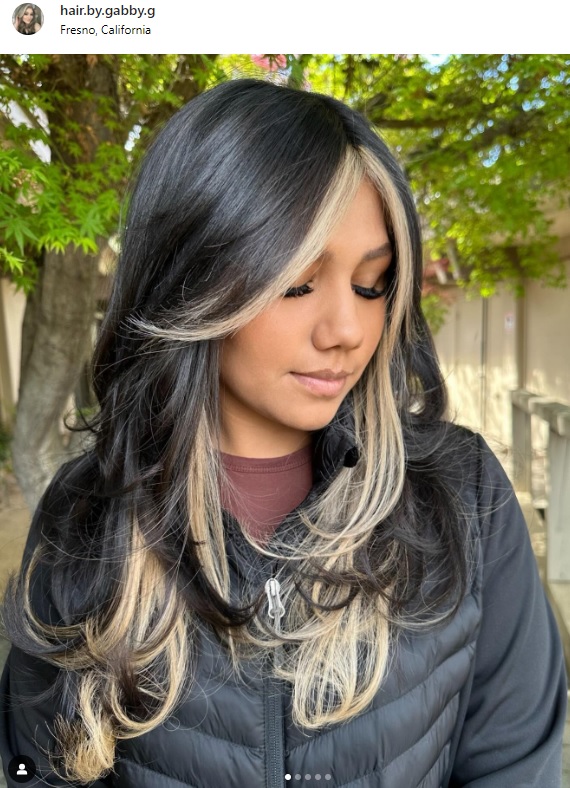 black hair with blonde highlights on butterfly cut