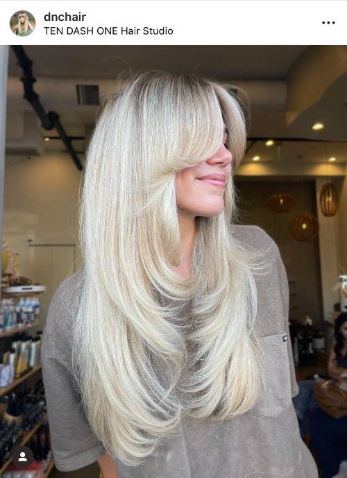 blonde-layered-butterfly-cut-with-curtain-long-bangs